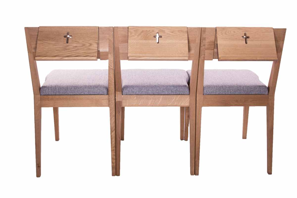upholstered oak church chairs ZOE with a counter for the Bible or songbook.